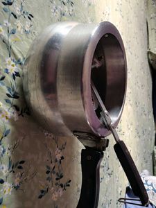 A silver pressure cooker