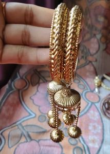 Elegant Gold-Tone Bangles with Tassel Charms