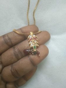 golden chain with ruby pendent