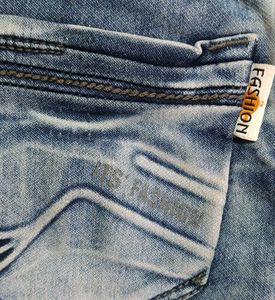 Distressed Blue Denim Jeans