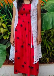 red coloured fit and flare dress with lace shrug