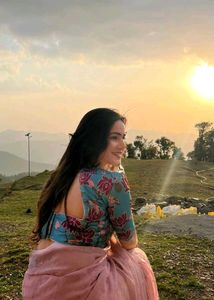 Elegant Pink Saree with Floral Blouse