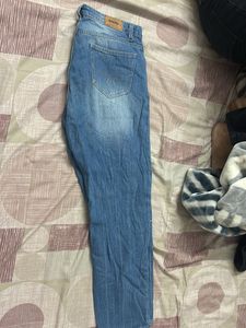 Distressed Blue Denim Jeans