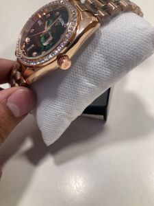 Rose Gold Rolex Watch with Green Dial