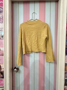 beige flared cardigan