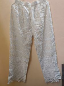 A kurta set with mirror work back design