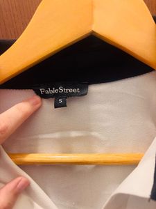 White Blouse with Black Collar
