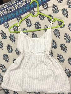 A causal white sleeveless summer Top