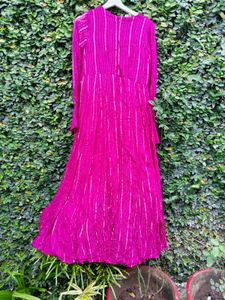 A Fuschia Colour Jumpsuit.