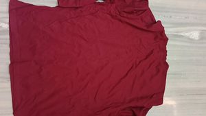 It's New Unused Maroon Coloured T Shirt.