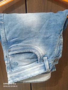 Stylish Light Wash Denim Jeans with Unique Patch D