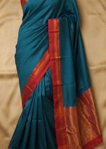 Elegant Teal Saree with Red Border
