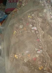 Embellished ivory net saree for engagement