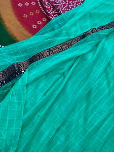 Elegant Green Saree with Intricate Border