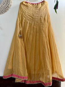 Fishcut Golden Lehenga with hot Pink Blouse