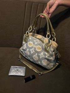 Chic Coach Shoulder Bag with Gold Accents