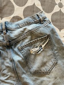 Distressed Light Wash Denim Jeans