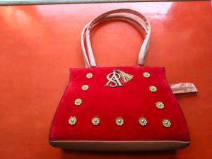 Red Velvet Handbag with Embellishments
