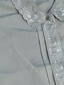 cream colored embroidery detail shirt