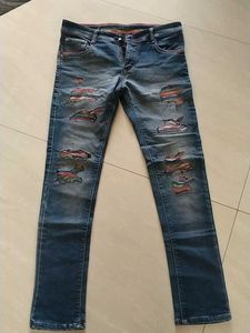 Distressed Patchwork Denim Jeans