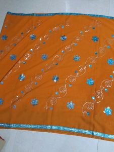 Orange Saree with Blue Embellishments