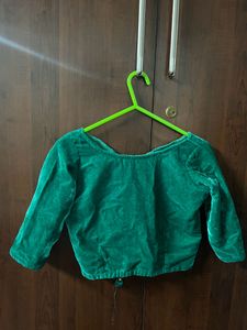 green blouse with golden skirt and shawl