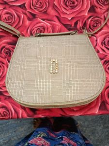 Gold sling bag