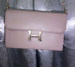 Stylish Beige Handbag with “H” Logo