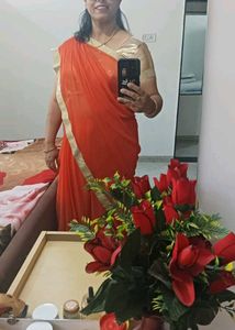 Vibrant Orange Saree with Golden Border