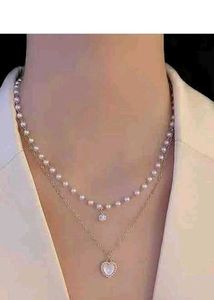 Layered Pearl Necklace with Heart Pendant