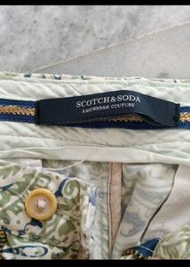 slightly torn shorts with brand