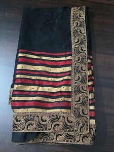 Elegant Black Saree with Red & Gold Stripes