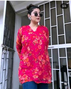 pink kurti with lining and lots of tussels