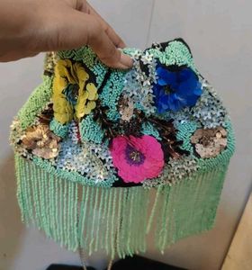 Beaded bag with tassel.