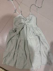 Safe green tiered babydoll mini dress