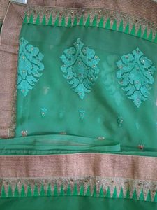 Elegant Green Saree with Golden Border