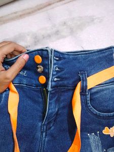 Stylish Blue Denim Capris with Orange Accents