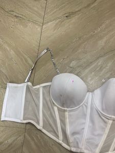 white corset top with silver chain detailing