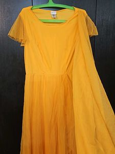 Beautiful Yellow Partywear Gown With Net Pallu