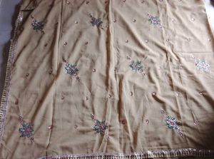 Elegant Beige Embellished Saree