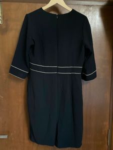 Elegant Black Wrap Dress with White Trim
