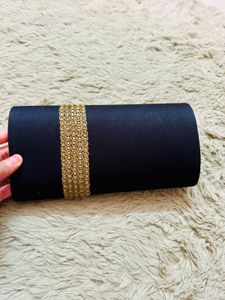 Elegant Black Clutch with Gold Embellishments