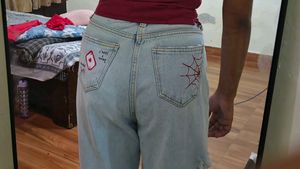 It's a blue wide leg jeans with hand paint