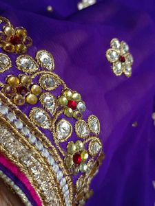 A Purple Blue Saree With Heavy Work