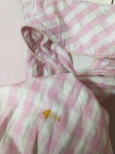 Checked atlomst knee length top with beautiful neck model and zip