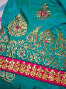 Teal Embroidered Silk Saree