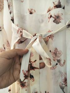 Wrap dress, with floral detailing