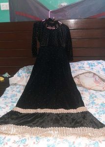 Elegant Black Velvet Gown with Gold Embellishments