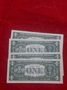 Four US Dollar Bills