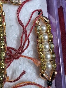 Elegant Pearl and Crystal couple  Rakhi